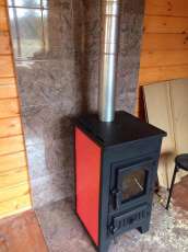 Купить стальной камин Везувий ПК-01 (270) в Бресте фото в интерьере в Бресте