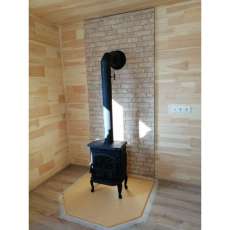 Чугунный камин со стеклом Сибирь 7 фото в интерьере в Бресте