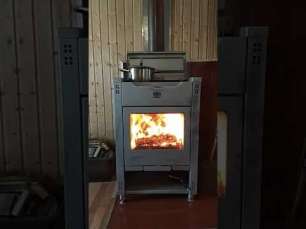 Стальной камин со стеклом Теплодар Кадриль фото в интерьере в Бресте