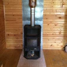 Печь-камин с шамотом Мета-Бел Ангара-Аква в интерьере фото в Бресте