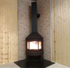 Стальной камин Бавария Мюнхен угловой чёрный (без перемычки) фото в интерьере в Бресте