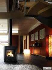 Печь-камин чугунный Invicta Carolo в интерьере Амазонка бай фото  в Бресте