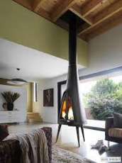 Печь-камин чугунный Invicta Pow-Wow в интерьере Амазонка бай фото в Бресте