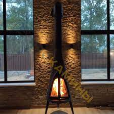 Печь-камин чугунный Invicta Pow-Wow в интерьере Амазонка бай фото в Бресте