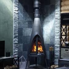 Печь-камин чугунный Invicta Pow-Wow в интерьере Амазонка бай фото в Бресте